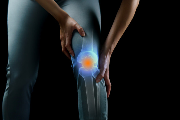 woman holds her hands knee pain knee highlighted blue medicine massage concept 46370 1927